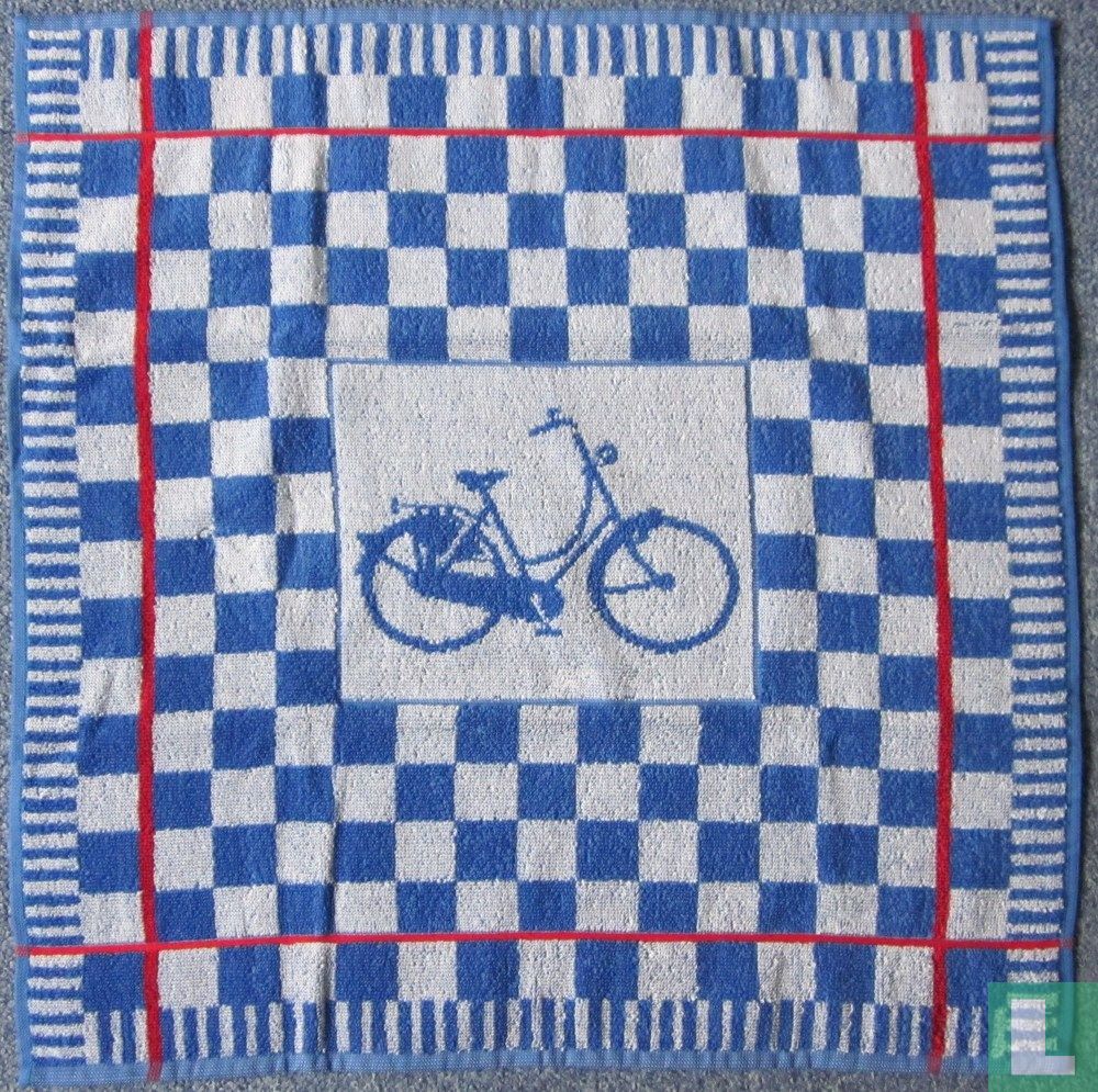 Blauwe damesfiets op handdoek