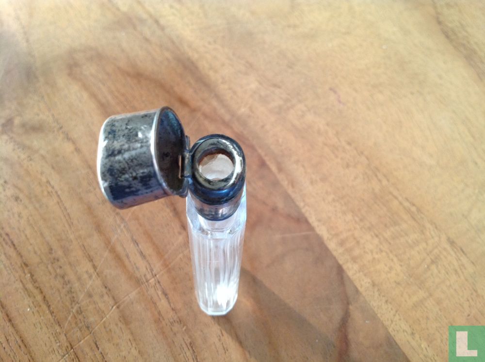 Bottle with silver cap
