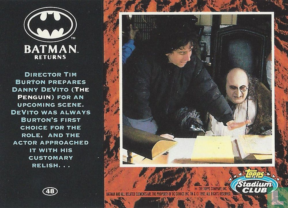 Director Tim Burton prepares Danny DeVito (The