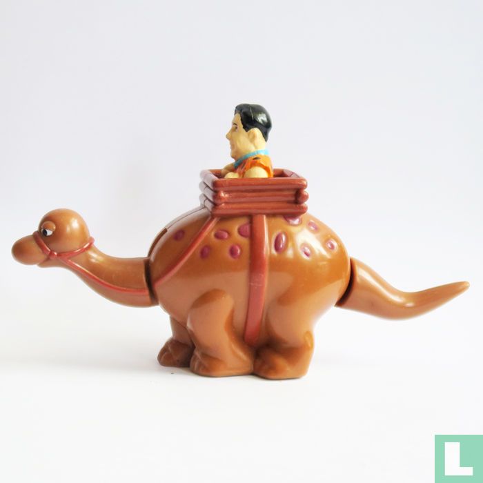Fred Flintstone über Dinosaurier