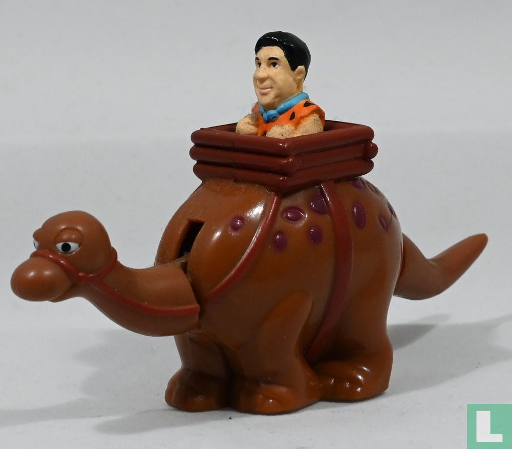 Fred Flintstone über Dinosaurier