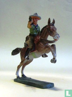 Cowboy on horseback with drawn revolver - Image 2