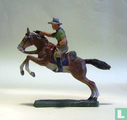 Cowboy on horseback with drawn revolver - Image 3