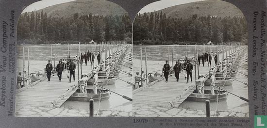 Inspecting a nearly completed pontoon bridge in the French sector of the Western Front. - Image 1