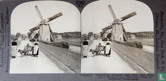 Industrious peasants with milk cart passing a windmill on a dike road west of Dordrecht - Image 1