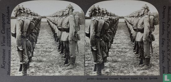 Helmeted German soldiers lined up for review. - Image 1