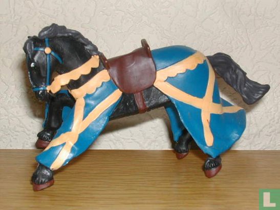 Horse with dressing in blue and yellow stripes