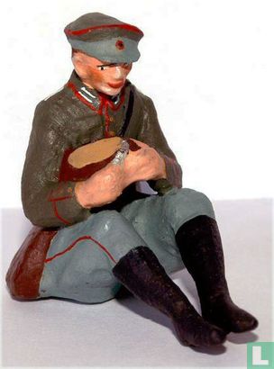 Soldier cutting bread - Image 1