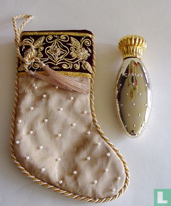 Golden flacon in beautiful oriental bag
