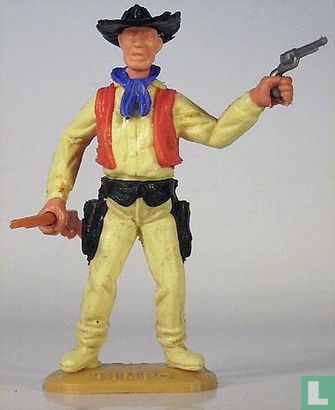 Cowboy avec les fusil et revolver