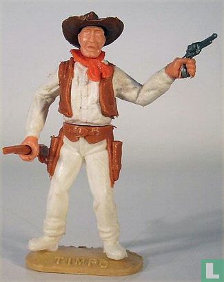 Cowboy with revolver and rifle