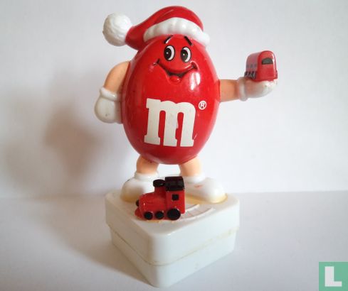 Red M&M as Santa Claus with train