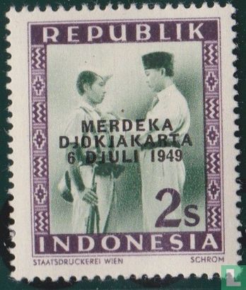 Soekarno decorates soldiers with overprint