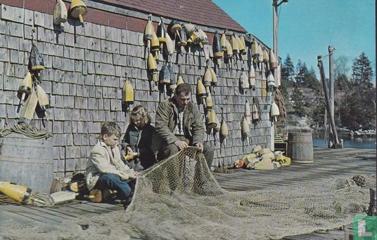 Maine Coast fisherman and his youngsters mend the nets - Bild 1