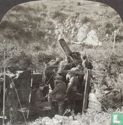 A camouflaged British anti-aircraft gun in action on Balkan front - Image 2