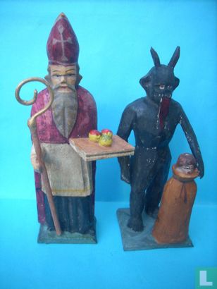 Sinterklaas with Krampus and child in bag