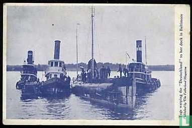 Tugs warping the Deutschland to her dock in Baltimore
