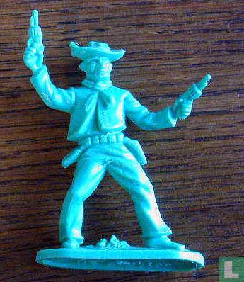 Cowboy avec 2 revolvers tirant en l'air (bleu-vert) - Image 1