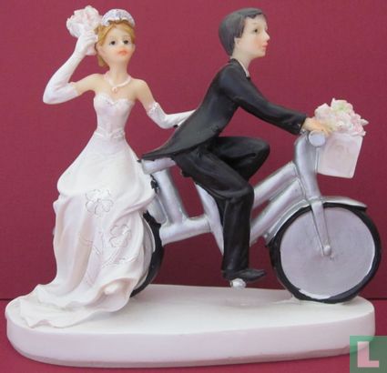 wedding couple on silver bicycle - Image 1