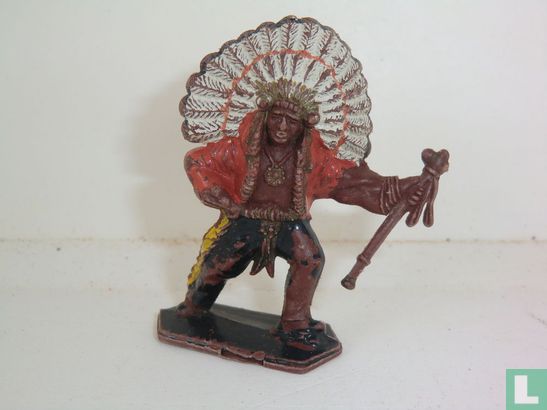 Chief leaning to his left with tomahawk in left hand. - Image 1