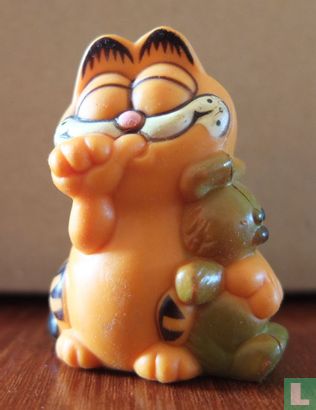 Garfield with bear and thumb in mouth