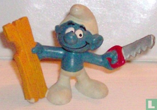 Handyman Smurf with saw and plank 