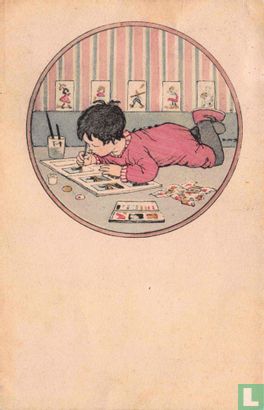 Liggende jongen tekent in boek - Image 1