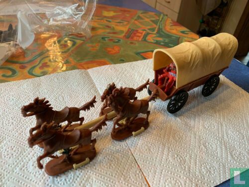 covered wagon with four horses [double trowel]
