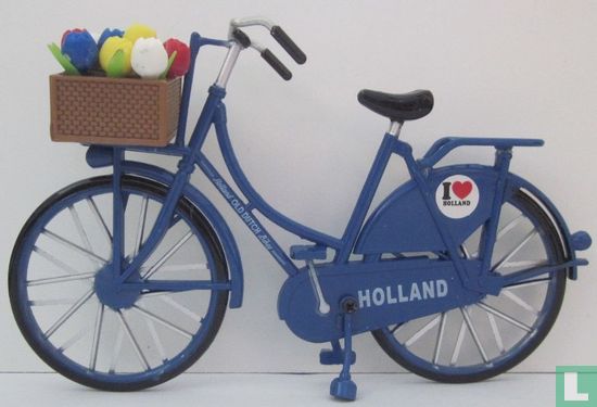 blue exercise bike with tulips - Image 1