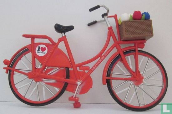 orange exercise bike with tulips - Image 2