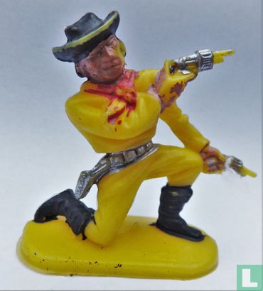 Cowboy kneeling with 2 revolvers (Yellow)