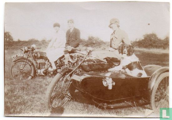 Vintage photograph. Three People with Motorcycles and Spaniel