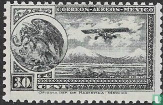Avion postal près des volcans Popecatépetl et Iztaccihuatl.