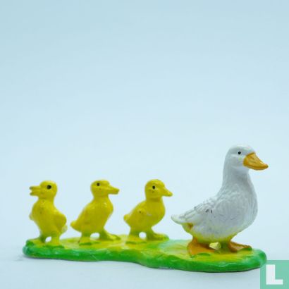 Duck with three chicks - Image 1