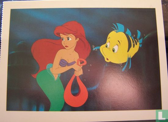 Ariel and Flounder the fish hed for her secret grotto