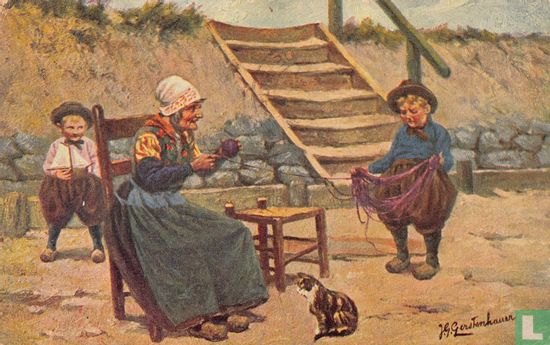Vrouw maakt bol wol met hulp van jongetje - Bild 1