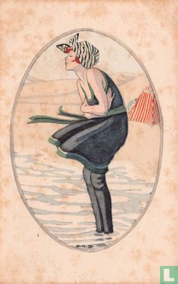 Vrouw in badpak staat in branding - Image 1