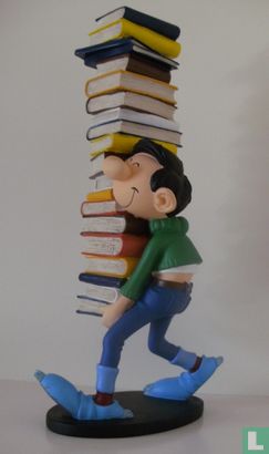 Gaston carries stack of books