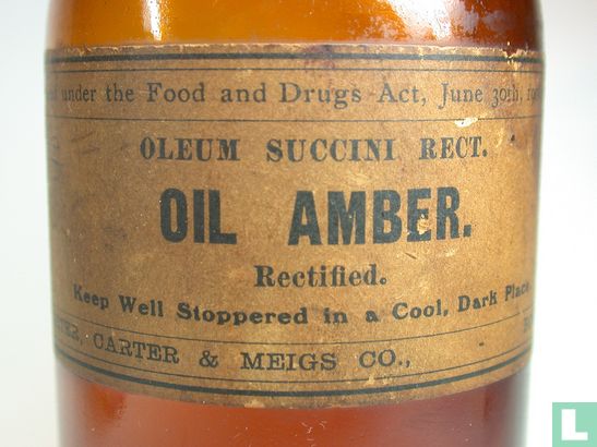Amber bottle with "OIL AMBER" label .... - Image 1