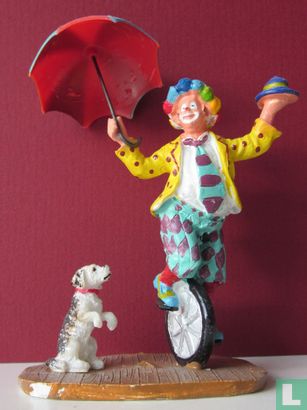 unicycle clown and dog make out
