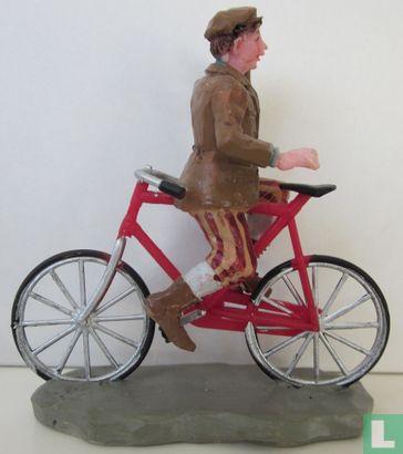 plastieke fiets met jonge heer erop (Risky business) - Afbeelding 1