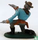 Cowboy kneeling with 2 revolvers - Image 2