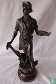  Metall-Figur auf Sockel eines Mannes mit Boot und houwel - Bild 1