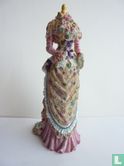 Mannequin with pink dress with floral apron - Image 1