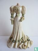 Mannequin dress in cream with green details of - Image 1