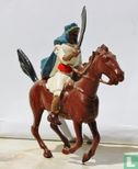 Arab on horse with scimitar blue cloak