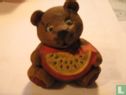 Bear eats a melon - Image 1