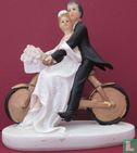 golden wedding couple on bike - Image 1