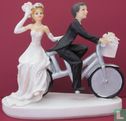 wedding couple on silver bicycle - Image 1
