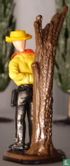 Cowboy caught against tree - Image 2